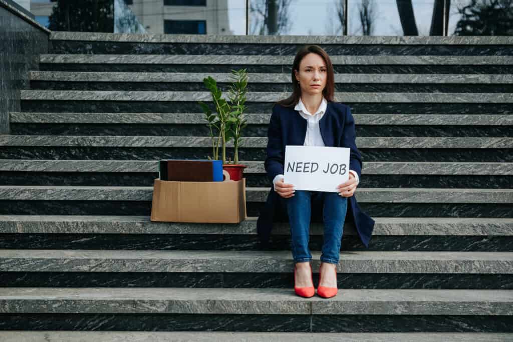 Unemployed woman on steps